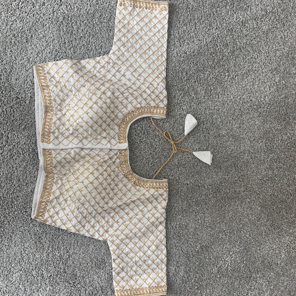Brand new silk embroidered blouse in golden thread.